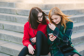 Two girls with gadget