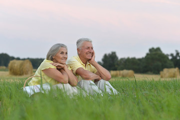 happy senior couple in summer