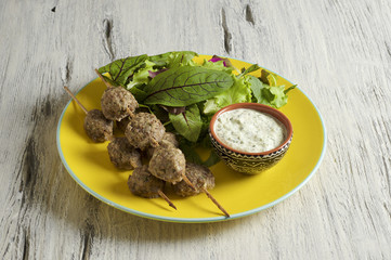 Keftedes, greek veal meatballs served with tzatziki sauce 