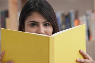 Woman with yellow book