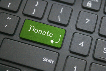 Close up of donate button on computer keyboard