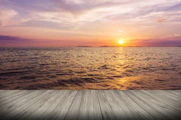 Photo sur Plexiglas Jetée Perspective of wood terrace against beautiful seascape at sunset