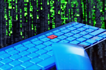 Naklejka premium Close up of keyboard, blue light. Red key.Selective focus. 
