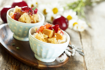 Plum dessert with cream cheese and biscuit