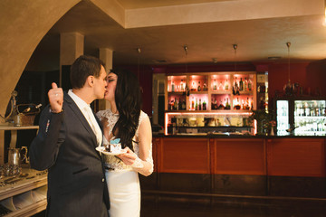 groom  kissing her beloved  bride  in lips