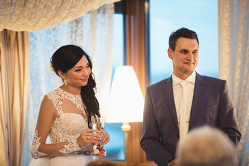 young happy  couple listening their  guests