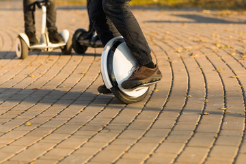 Man legs mono wheel personal electrical transport street outdoor