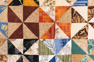 Blanket of colored triangular patches, patchwork, background