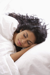 Head shot of Indian woman sleeping in bed