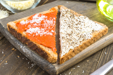 triangles of wholemeal bread spread with cream cheese and spicy