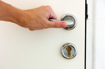 Person hand on door handle