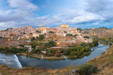 Fototapeta na wymiar Panorama of Old city of Toledo and river Tajo at dusk, Castilla La Mancha, Spain