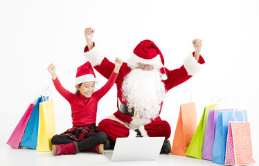 happy santa claus  and child Christmas Online Shopping