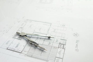 Desk of Engineering project in construction site or office with morning light.Construction concept.Engineering tools.Vintage tone retro filter effect,soft focus(selective focus)