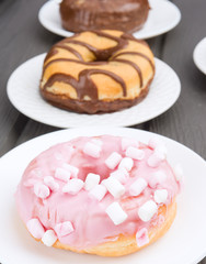 group of  variety donut on  black wooden