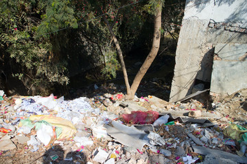 Terrible unsanitary conditions of Indian slum. The side of the road 1