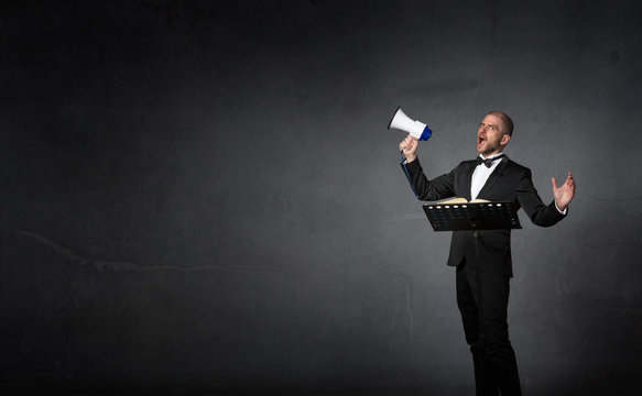 opera singer with lectern and megaphone