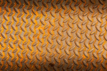 Surfaces metal floor sheet with rust.