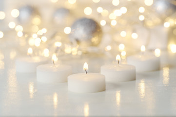 Candles and Christmas decoration with Defocused lights.