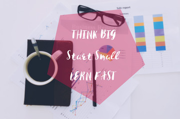 Inspirational motivation quote about business on clipboard background and office desk with laptop, notebook and coffee cup.