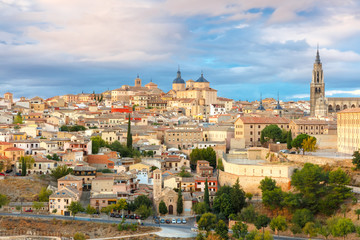 Fototapeta na wymiar Old city of Toledo with Primate Cathedral of Saint Mary, churches of San Ildelfonso, San Roman and Santo Tome at sunset, Castilla La Mancha, Spain