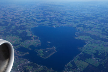 GERMANY - October 2016: The chiemsee as seen from an airplane, plane view of a lake