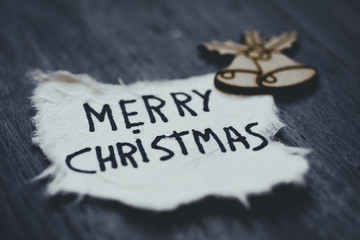 text merry Christmas in a piece of paper