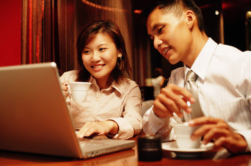 Executives looking at laptop