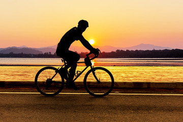 Fototapeta premium Cycling at beach on twilight