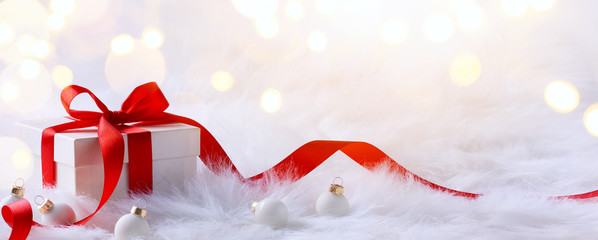 Christmas card with gift boxes and Christmas decorations on a wh
