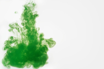 green ink poured in water