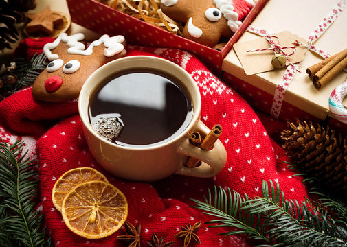 Hot christmas tea with spices and christmas gingerbread. Christmas still life. Overhead view
