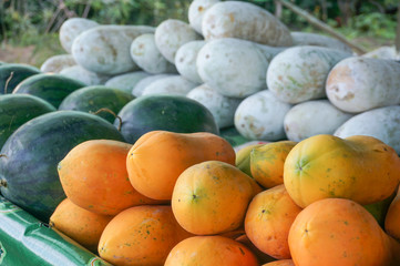 Fresh papayas in farmer market on street