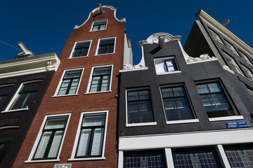 Fototapeta na wymiar Classic Amsterdam buildings with gables and hoists, Prinsengracht, Amsterdam
