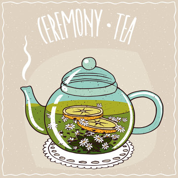 Fototapeta Transparent glass teapot with hot brewed chamomile tea, lie on a lacy napkin. Beige background and ornate lettering Ceremony tea. Handmade cartoon style