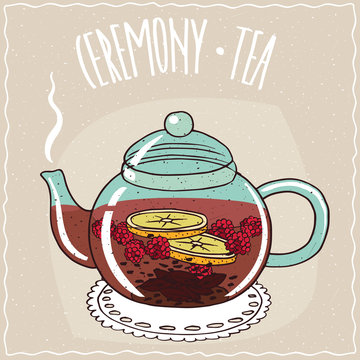 Fototapeta Transparent glass teapot with hot brewed tea raspberry, lie on a lacy napkin. Beige background and ornate lettering Ceremony tea. Handmade cartoon style