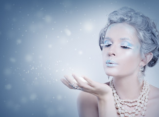 Winter Model Snow Queen. Woman Fashion Model Blowing Snow