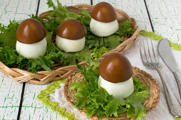 Creative idea of design of stuffed eggs in the form of porcini