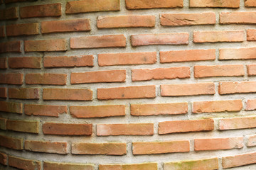 Orange brick wall of artesian well.
