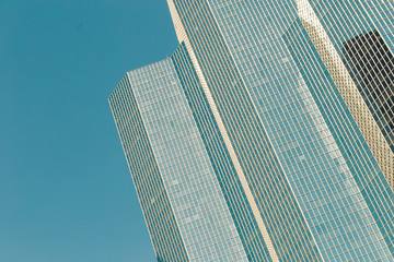 Skyscrapers with glass facade. Modern buildings in Paris business district. Concepts of economics, financial, future.  Copy space for text. Dynamic composition. Toned