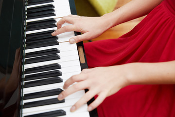 Fototapeta premium Piano hands pianist playing Musical instruments details with player hand closeup