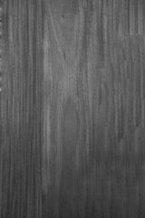 Obraz premium Dark brown scratched wooden cutting board. Wood texture