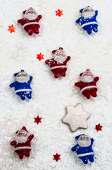 Santa Clauses small red and blue on a white background
