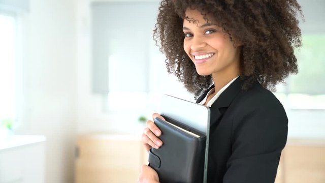Portrait of attractive mixed-race businesswoman