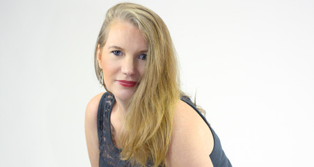Naklejka premium Mature Blonde Female Bending Over Looking at Camera 