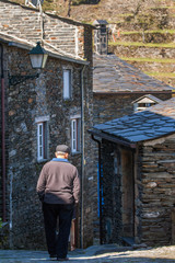 old man walking down the street