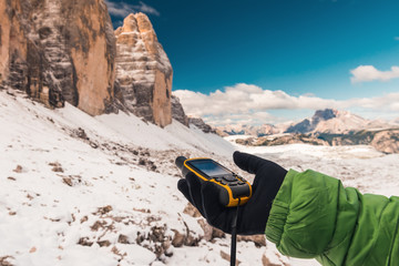 GPS navigator in hand Dolomites Alps