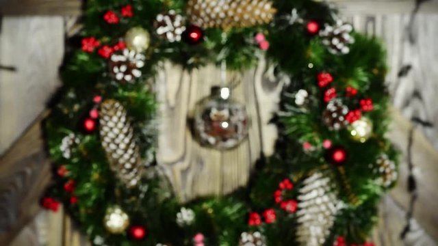 Christmas wreath with electric garland. Garland is blinking.