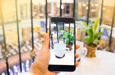 Taking photo of white cup