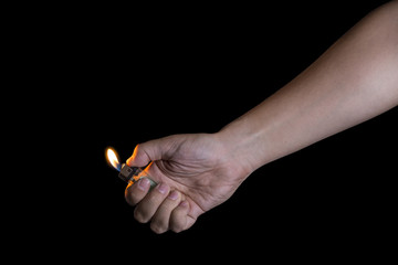 Hand and lighter on black